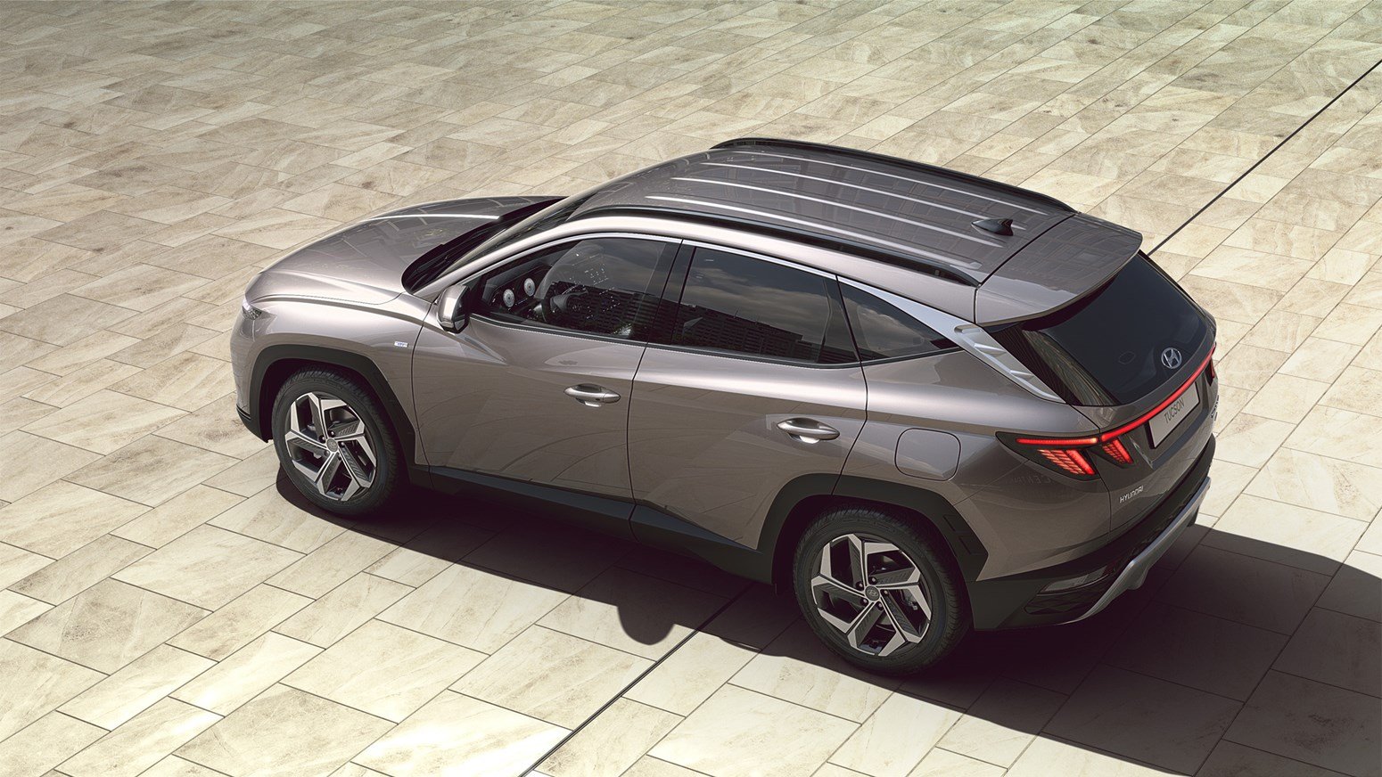 Hyundai TUCSON Hybrid i färgen Silky Bronze.