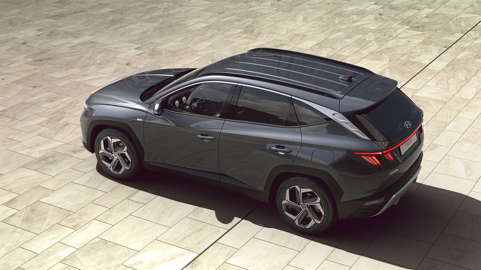 Hyundai TUCSON Hybrid i färgen Dark Knight Grey.